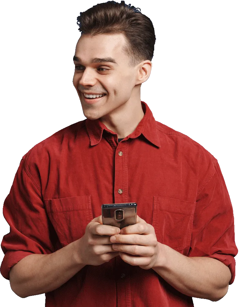young white man wearing shirt smiling and using ce